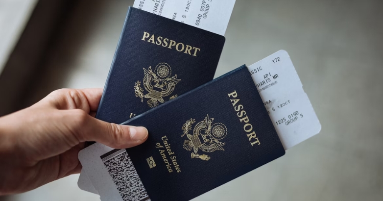 A pair of individuals displaying two passports, representing essential travel tips for families booking flights.